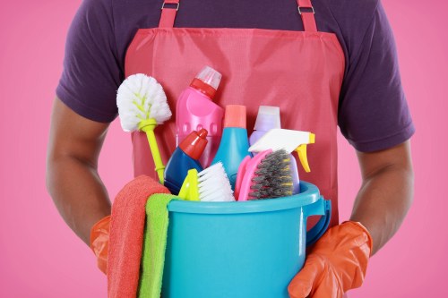 Technician preparing carpet cleaning equipment with safety awareness